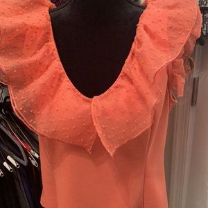 Beautiful coral top with tulle adornments. Great with jeans, pants or a skirt.